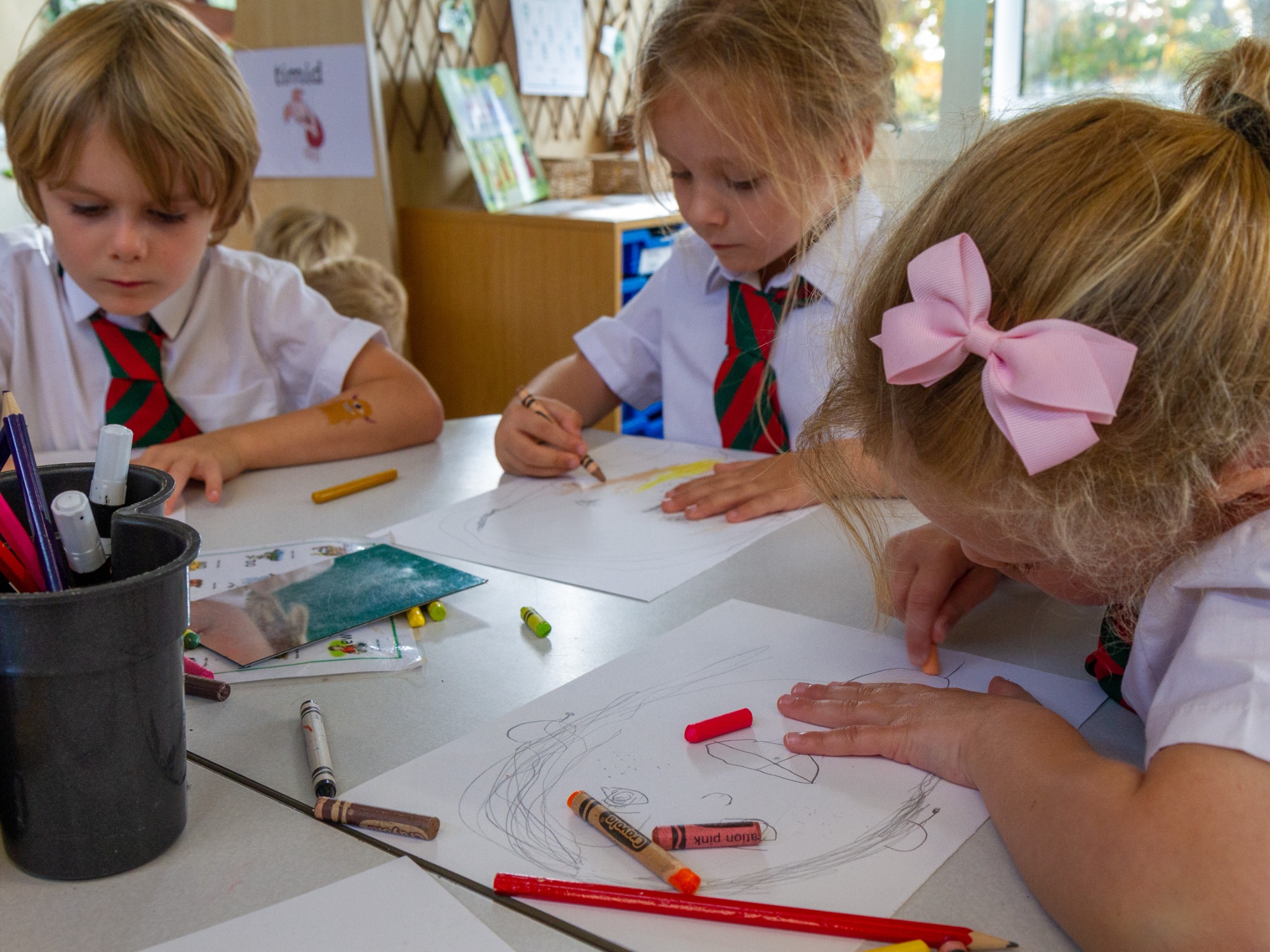 Reception children in their class drawing